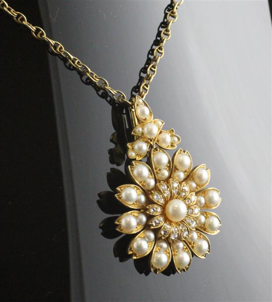 A gold diamond and pearl flowerhead