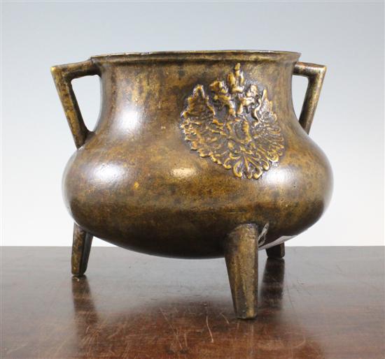A three legged bronze cauldron