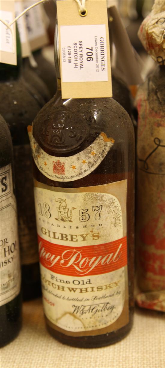 Four bottles of Gilbeys Spey Royal