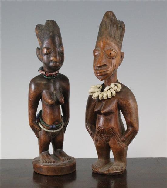 A near pair of Yoruba figures of