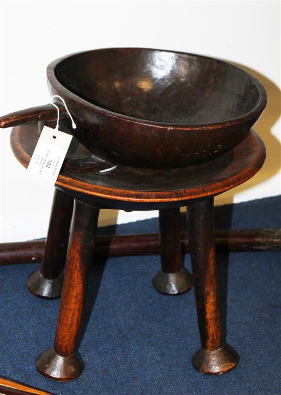 An African carved wood bowl with 1711ed