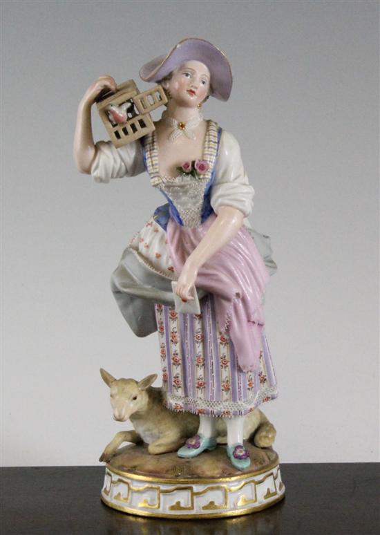 A Meissen figure of a lady holding