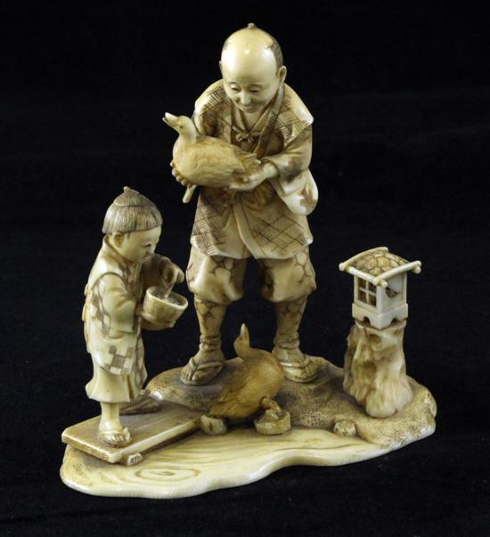 A Japanese ivory group of a man 17128b
