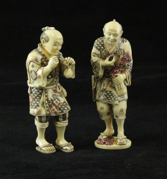 A pair of Japanese tinted ivory 171288