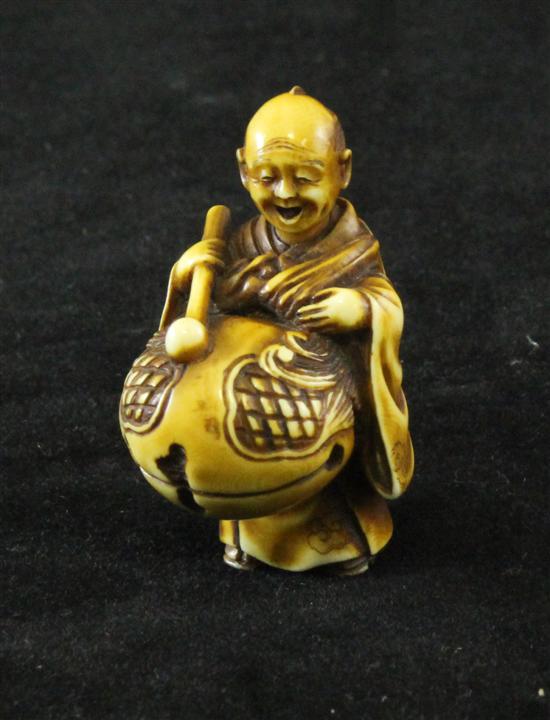 A Japanese ivory netsuke of a drumming 171290