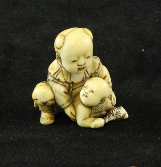 A Japanese ivory netsuke of a child