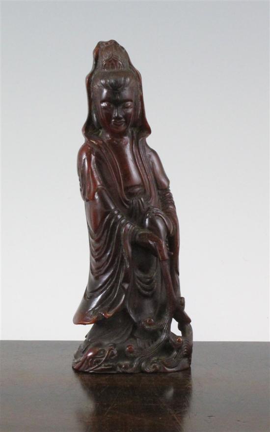 A Chinese horn standing figure of Guan