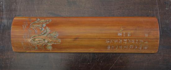 A Chinese bamboo brush rest carved