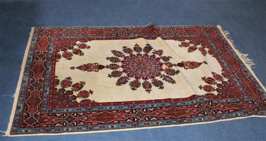 A Persian rug with central foliate