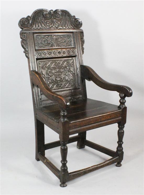 A mid 17th century panel back armchair