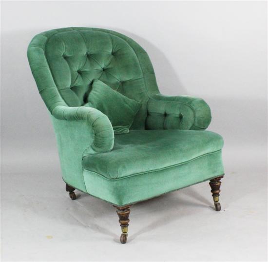 A Victorian button back armchair