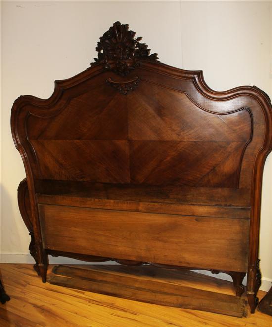 A 19th century French walnut bedstead