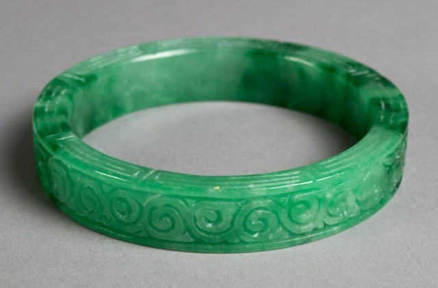 A Fine Chinese Carved Jade BangleFinely