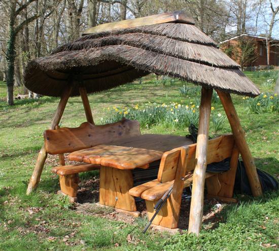 A naturalistic wooden garden bench 171871