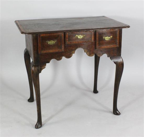 A mid 18th century oak and walnut