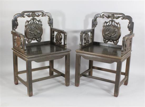 A pair of Chinese carved dark hardwood
