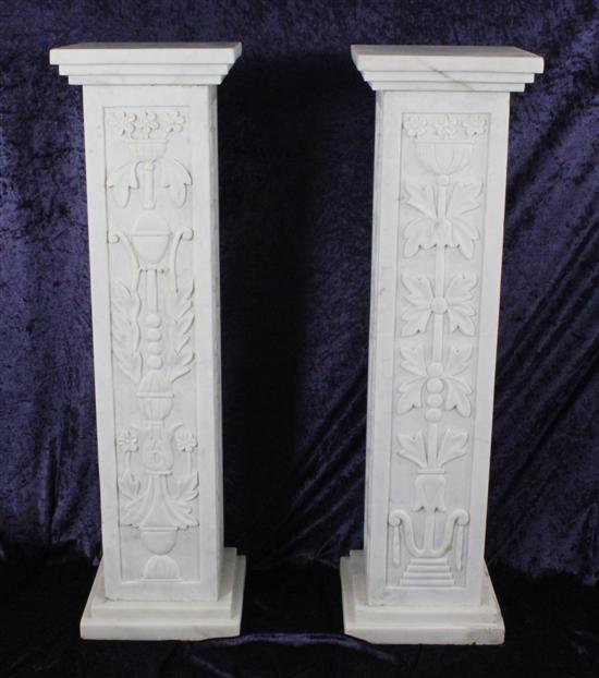 A pair of carved white marble columns