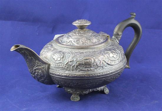 A George III embossed silver teapot