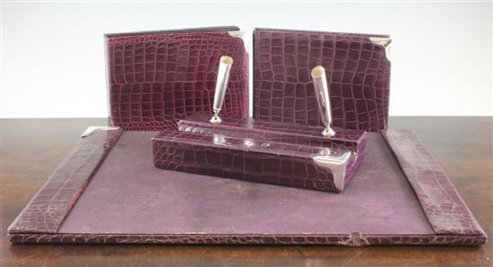 An Asprey silver mounted purple crocodile