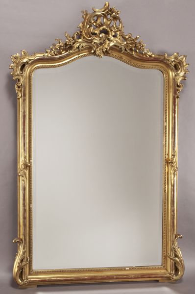 Louis XV style carved gilt mirroradorned