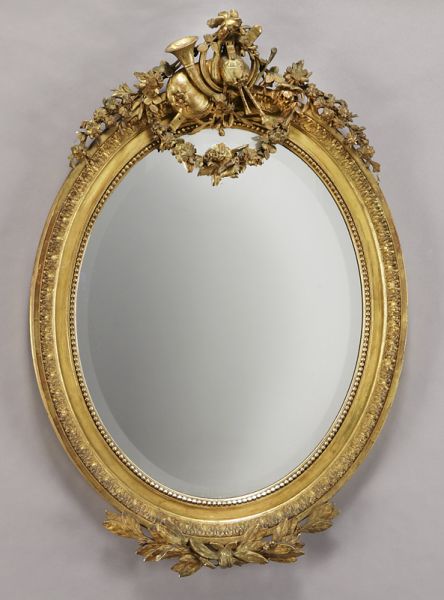 Belle Epoque gilt framed oval beveled
