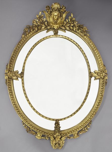 Louis XVI style oval carved gilt
