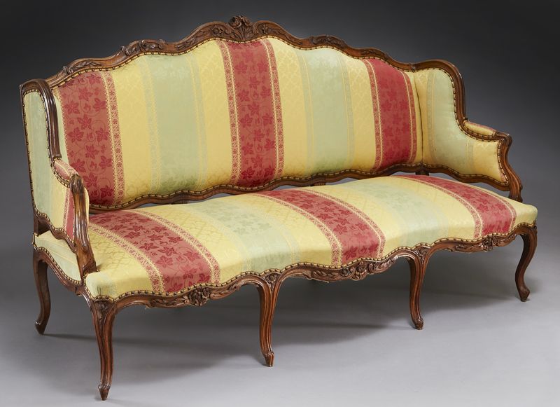 Louis XV upholstered walnut canape