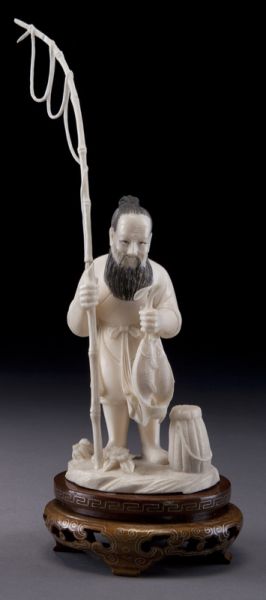 Chinese carved ivory fisherman (International