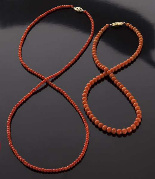 (2) Chinese carved red coral necklaces(International