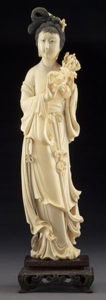 Chinese carved ivory beauty holding 174511