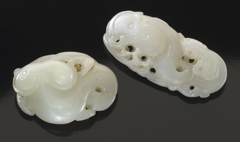 (2) Chinese carved white jade togglesdepicting