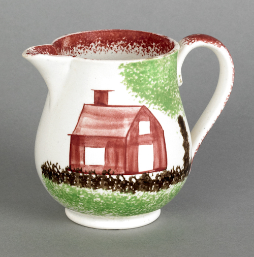 Red spatter creamer with schoolhouse