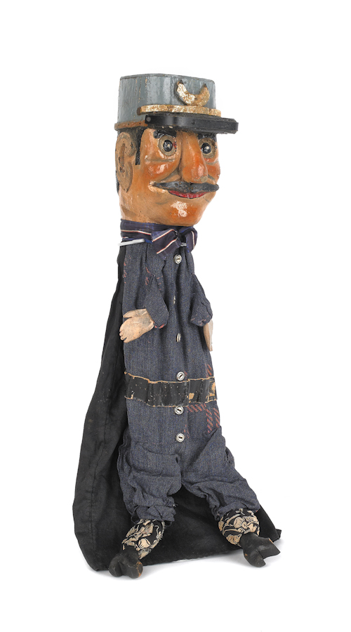 Carved and painted policeman puppet