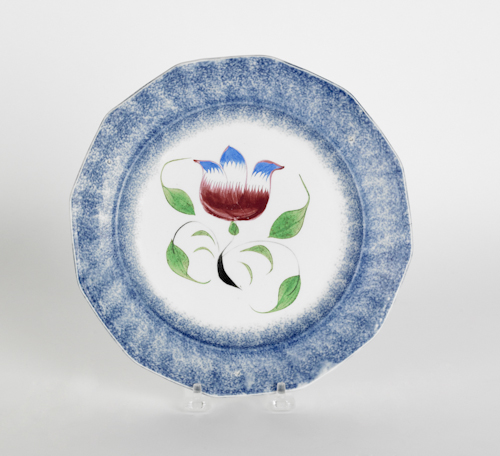 Blue spatter plate with a tulip 19th