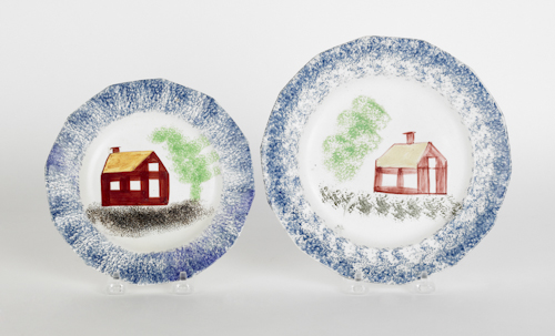 Two blue spatter plates with schoolhouses