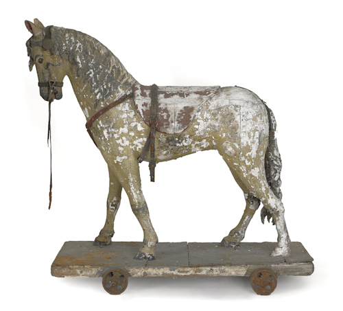 Carved and painted riding horse