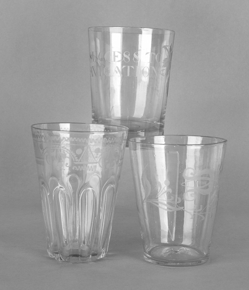 Three etched colorless glass flips