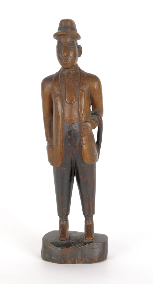 Carved figure of a gentleman early