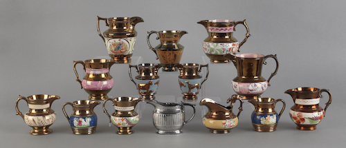 Fourteen luster pitchers 19th c.