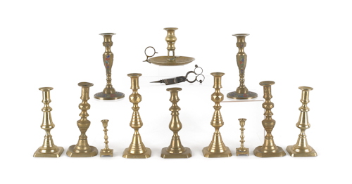 Collection of brass candlesticks