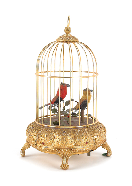 Gilt metal bird cage with two singing