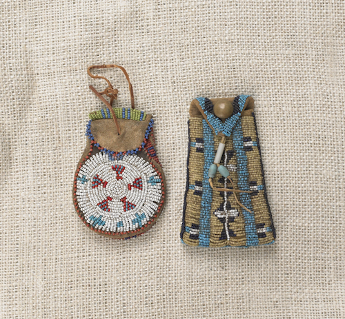 Two small Comanche beaded hide pouches