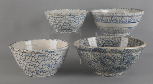 Four blue spongeware mixing bowls