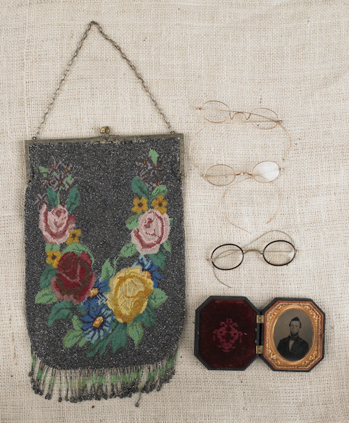 Beaded purse a tin type and eyeglasses.