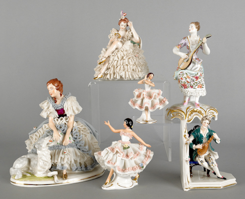 Four Dresden porcelain figures together