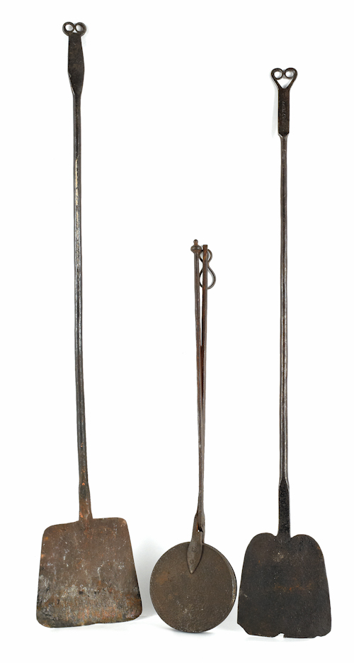 Two wrought iron peels with rams