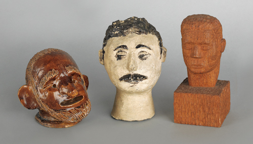 Two earthenware heads together