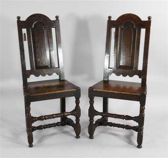 A pair of Queen Anne oak and fruitwood