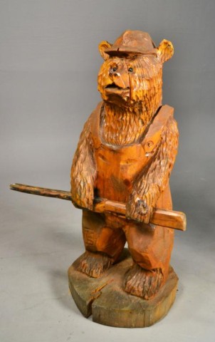 HAND CARVED WOODEN BEAR WITH GUNDepicting