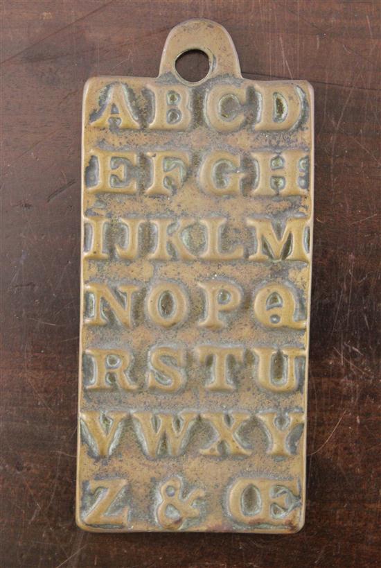A cast brass alphabet plaque the 17384e